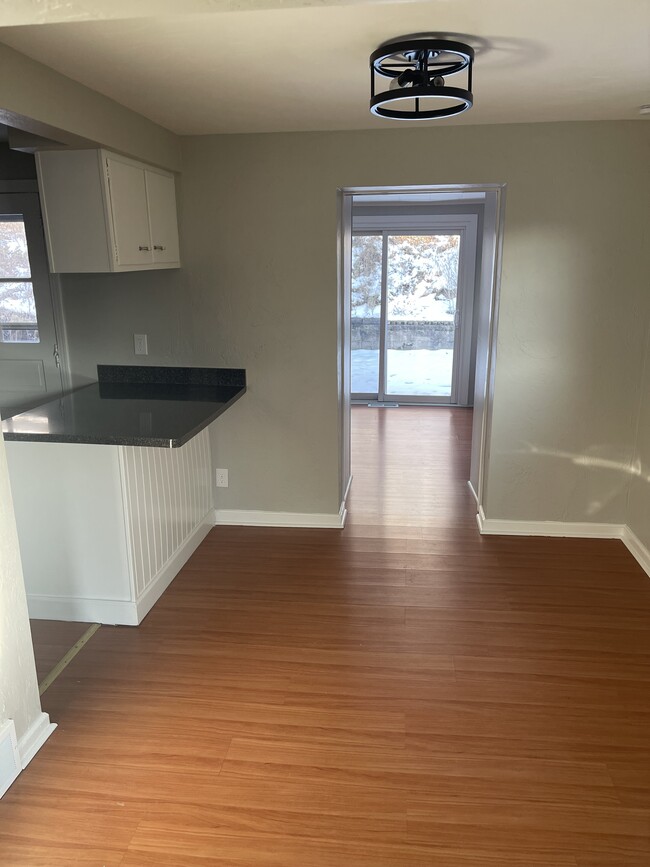 Standing in living room looking through dining room into 3 room - 4614 Mount Troy Road Ext Casa