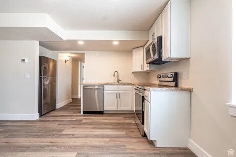 Kitchen with stainless steel appliances - 530 W 900 S Unit B