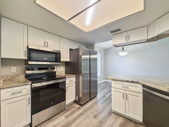 Photo - Move-In Ready 3 Bed Home with Garage & Fenced Yard in Tampa, FL