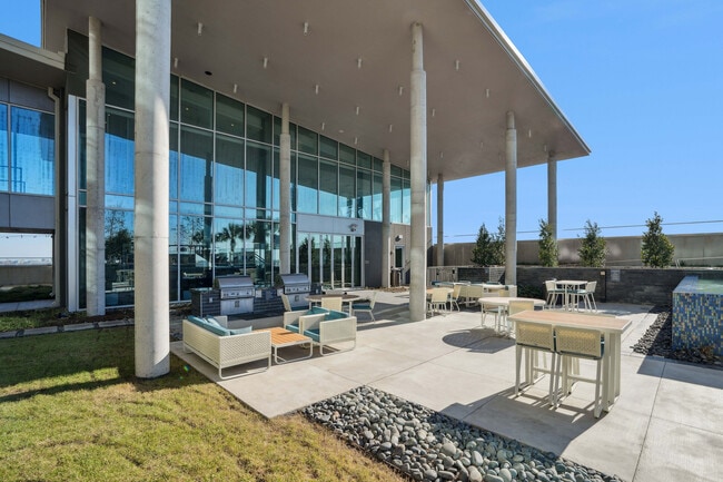 Luminary Residences Pool Deck with Outdoor Grills and Dining Areas