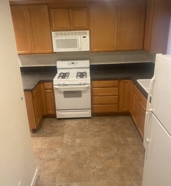 Photo - LIKE NEW three bedroom with fantastic updates, one car garage and private newly fenced front patio!