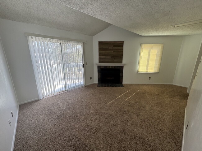 Photo - Gorgeous, 1 bedroom apartment with in-unit laundry, a fireplace, river and walking path. Unit 4