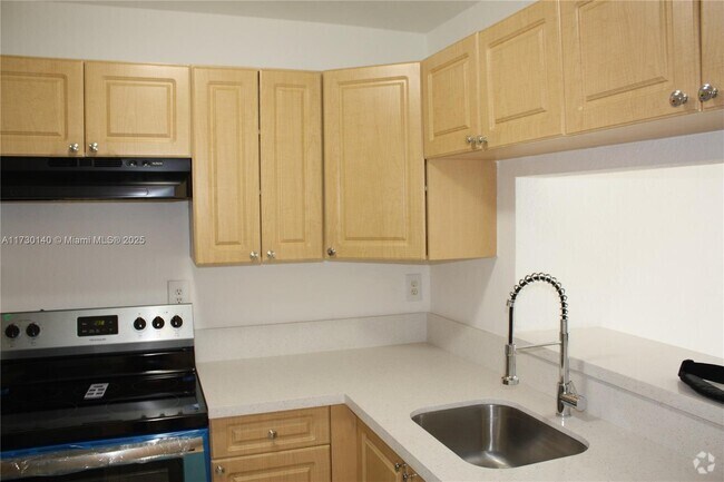 Building Photo - 1095 W 77th St Unit 209 Rental