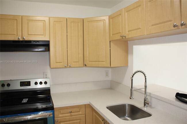 Photo - 1095 W 77th St Apartment Unit 209