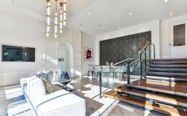 Indoor Lounge Area with Upholstered Sofas and Raised Bar Seating Section - The Lights at Northwinds Rental