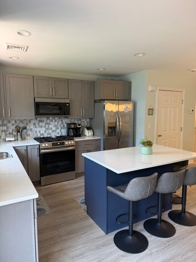 Kitchen with island - 560 Silver Sands Rd Unit 1502