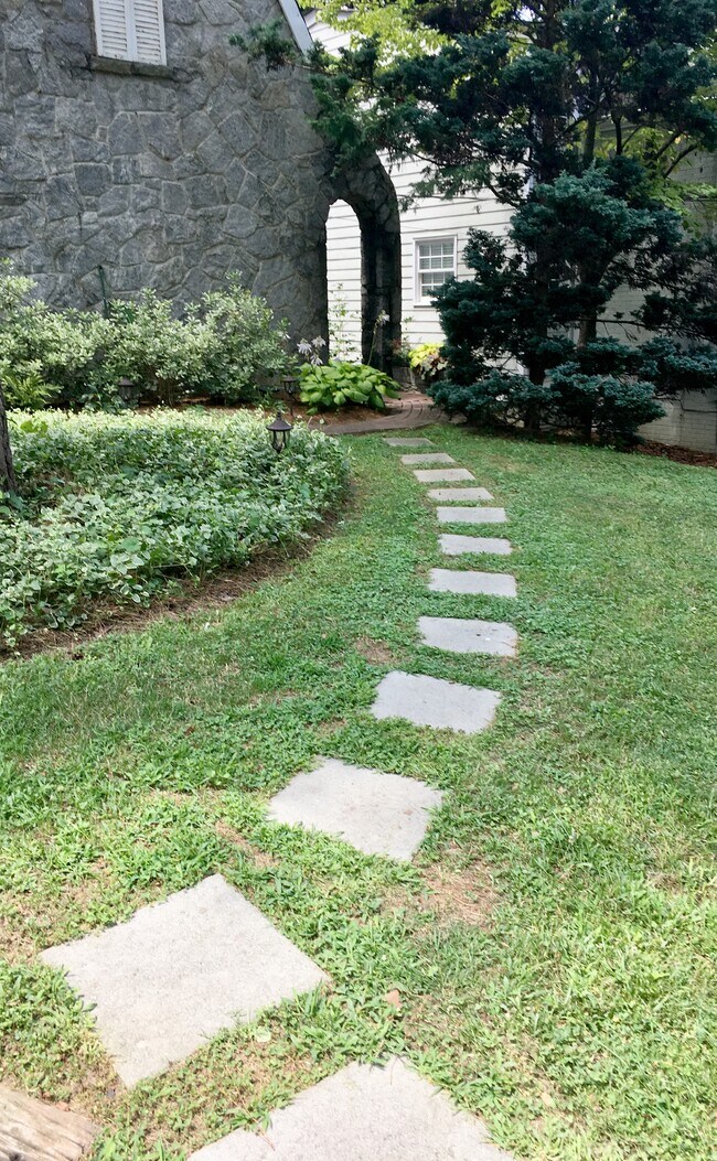 Private entrance with walkway from parking pad. - 629 Hillpine Dr NE