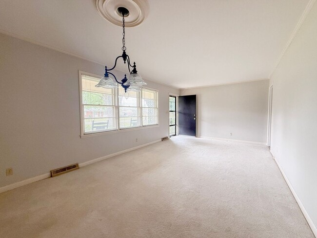 Photo - 3-Bedroom Home with Spacious Yard, Storage Shed & Natural Light