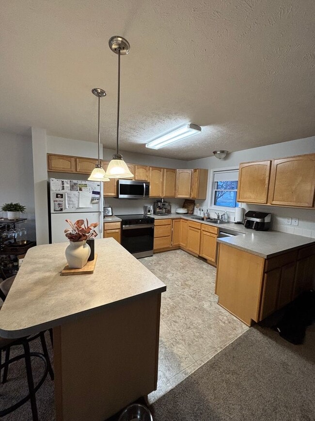 Photo - End-Unit Townhome with 2-Car Garage!!