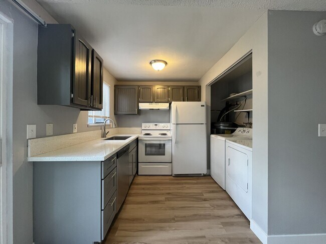 Photo - Comfortable 2 Bedroom Retreat with a Beautiful Tree-Lined Setting, Washer/Dryer & Modern Kitchen Unit #A