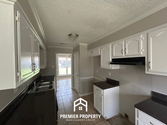Photo - Spacious 4BR/2BA Near Southwind | High Ceilings, Brick Fireplace & 2-Car Garage
