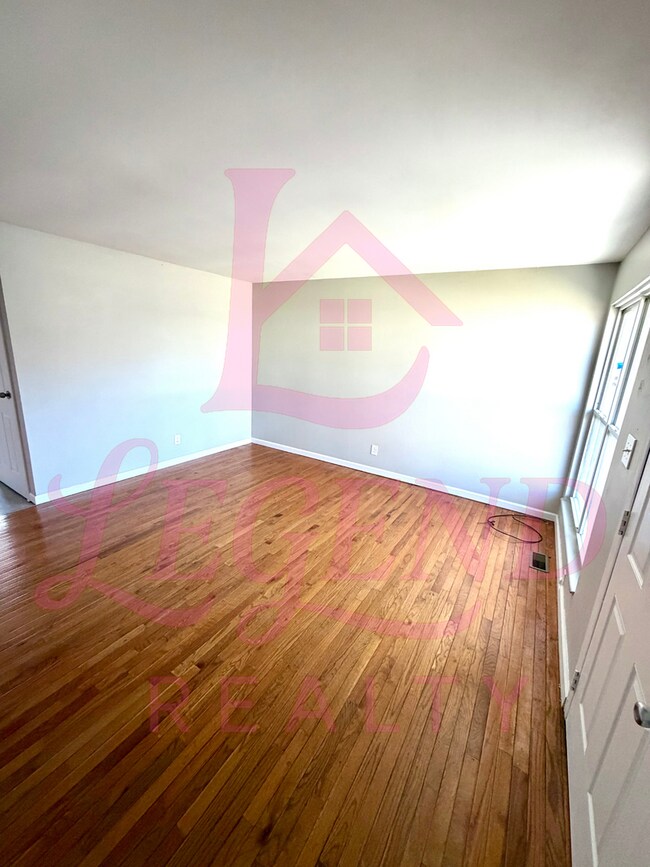 Photo - Spacious 4-Bedroom Home with Private Primary Suite & Hardwood Floors!