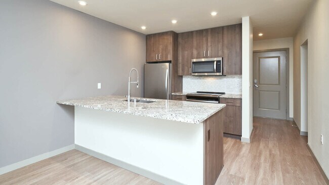 Kitchen with Breakfast Bar and Stainless Steel Appliances