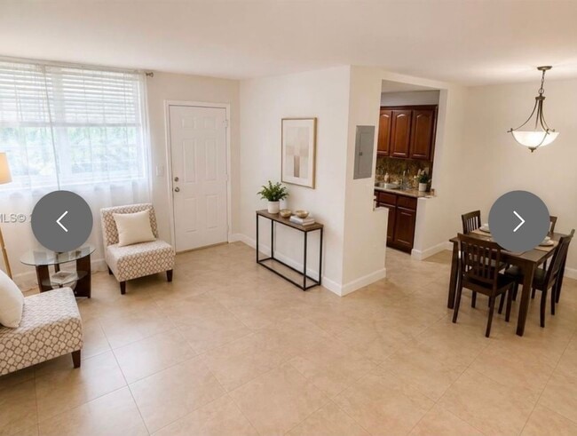 Living, dining and partial kitchen view - 12590 NE 16th Ave Unit 605