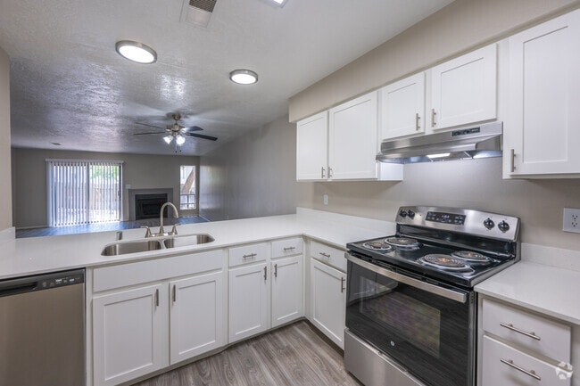 2BR, 2.5BA - 1,282SF - Kitchen and Living Room