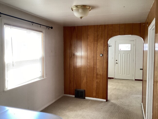 Photo - Charming 2BR Home with Spacious Yard, Detached Garage & Garden Oasis Unidad A