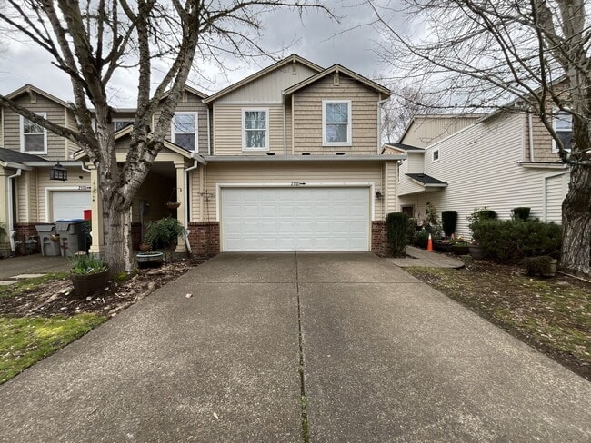 Photo - Inviting Two-Story 3BR Home Featuring Gas Range, Walk-In Closet, and Built-In Deck Seating