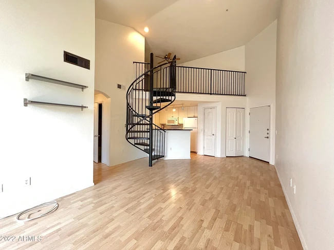 View of Loft & Entry From Family Room - 1701 E Colter St Apartment Unit 435