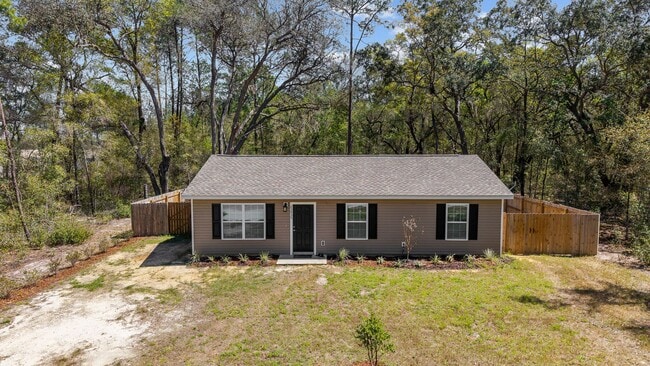 Building Photo - *** NOT READY FOR SHOW OR MOVE IN UNTIL AUGUST 1 *** Newer 3/2 in the country with fenced yard an...