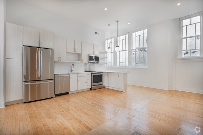 2BR, 2BA - 952SF - Living Room and Kitchen