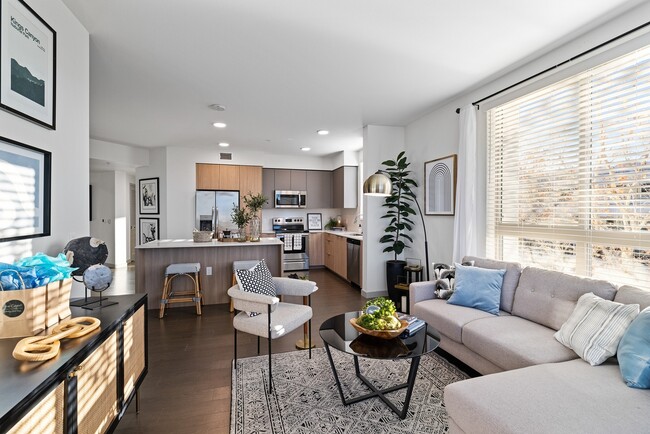 This sunlit open-concept layout blends comfort and sophistication, offering the perfect space to relax, cook, and entertain—all in one. - The Grant