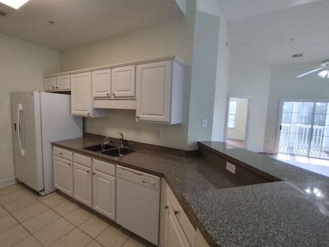 Photo - MOVE IN READY! 3rd Floor Condo with BEAUTIFUL Pond View! Central Location!