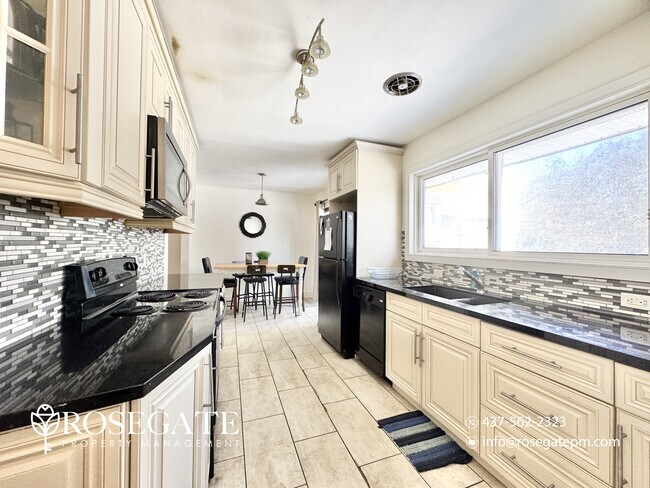 Photo - Charming 2-Bedroom Detached Home with Fireplace & Backyard Deck in Oshawa