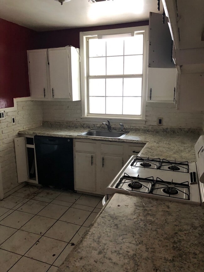 Photo - Nice three bedroom with hardwood floors, and Two car garage