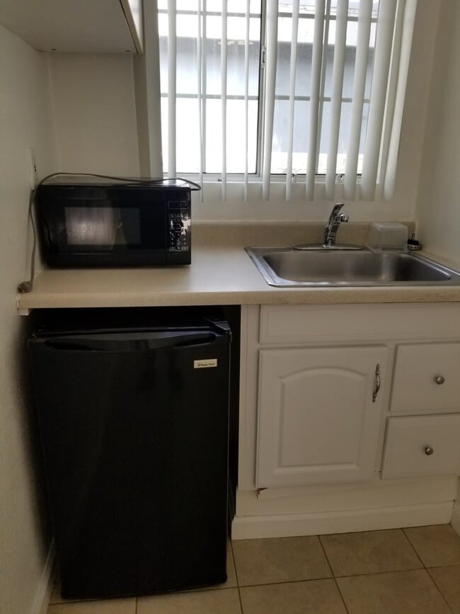 kitchen with refrigerator & microwave