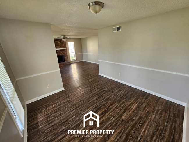 Photo - Charming 3BR/2BA Kirby Mills Cove | Hardwood Floors, Rustic Brick Fireplace & Garage