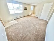Experience the warmth and comfort of your new living room, filled with natural light.