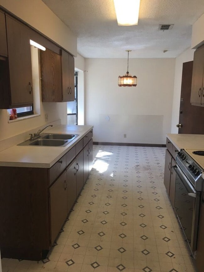 Photo - Welcome to this inviting 4-bedroom, 2-bathroom home.