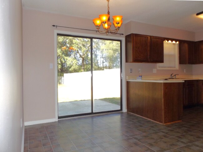 Photo - -Bed, 1.5-Bath Duplex in Bellview with Garage, Indoor Laundry, and Private Fenced Backyard