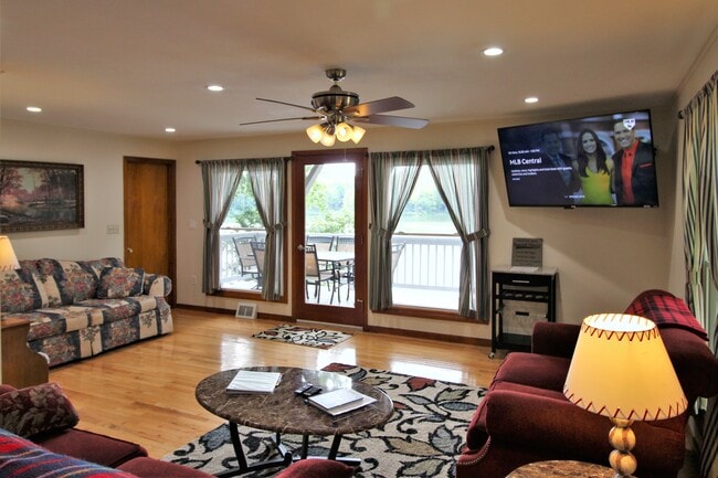 Large windows with deck overlooking the lake - 102 Holiday Ln Unit 2