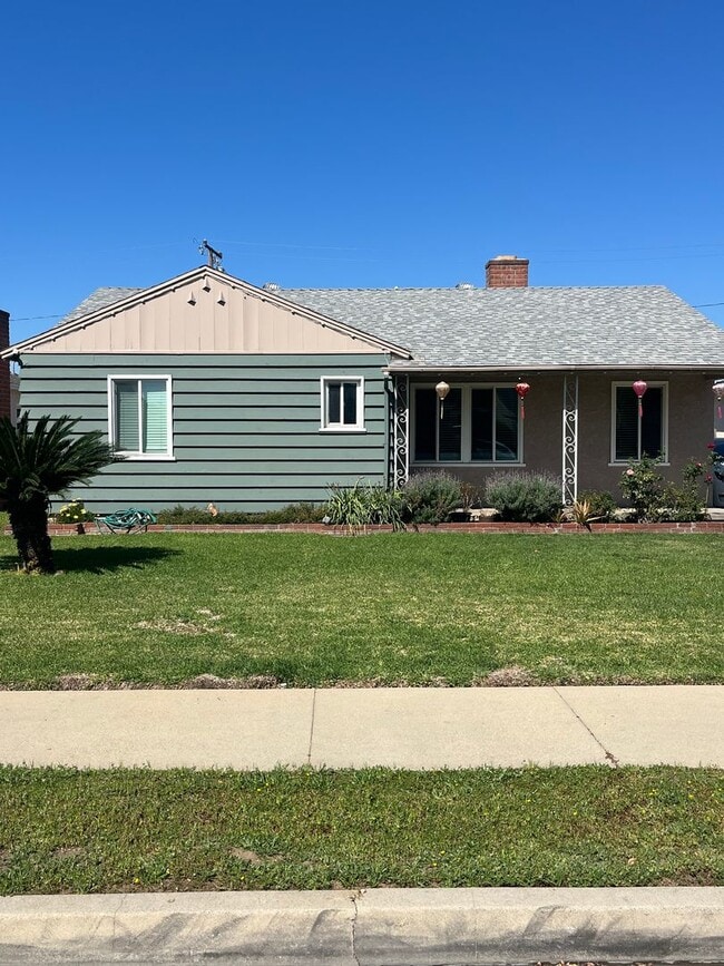 Photo - Home with a Cabin Style Family room and backyard Oasis