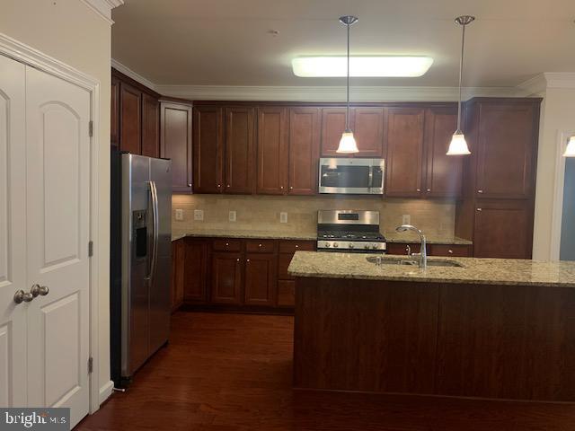 Building Photo - 13723 Neil Armstrong Ave Unit 203 Rental