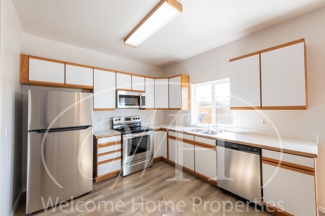 Photo - Enjoy the Open Floor Plan and Generous Storage in this College Place Duplex Unit 23 Earl