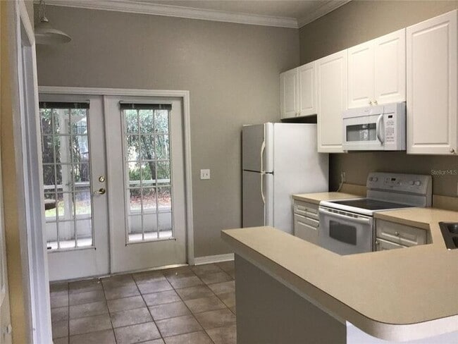 Photo - 2 Bedroom 2 Bath Corner Unit Ground Floor Condo Near UCF with Tile Flooring and Scenic View!