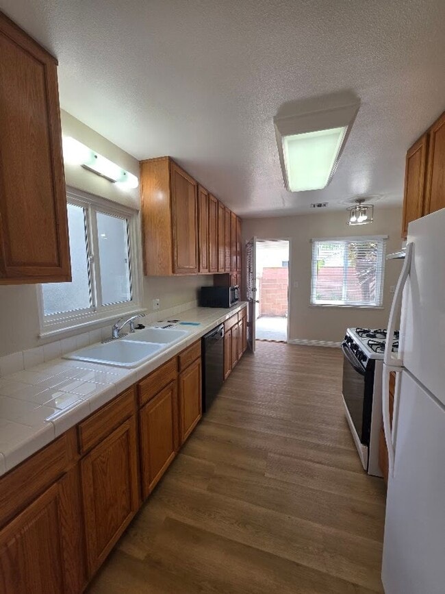 Photo - TURNKEY-RENT READY SPACIOUS 2BD/2BA HOME, 2-CAR GARAGE WITH AN AUTOMATIC ROLL-UP DOOR, LARGE COVE...