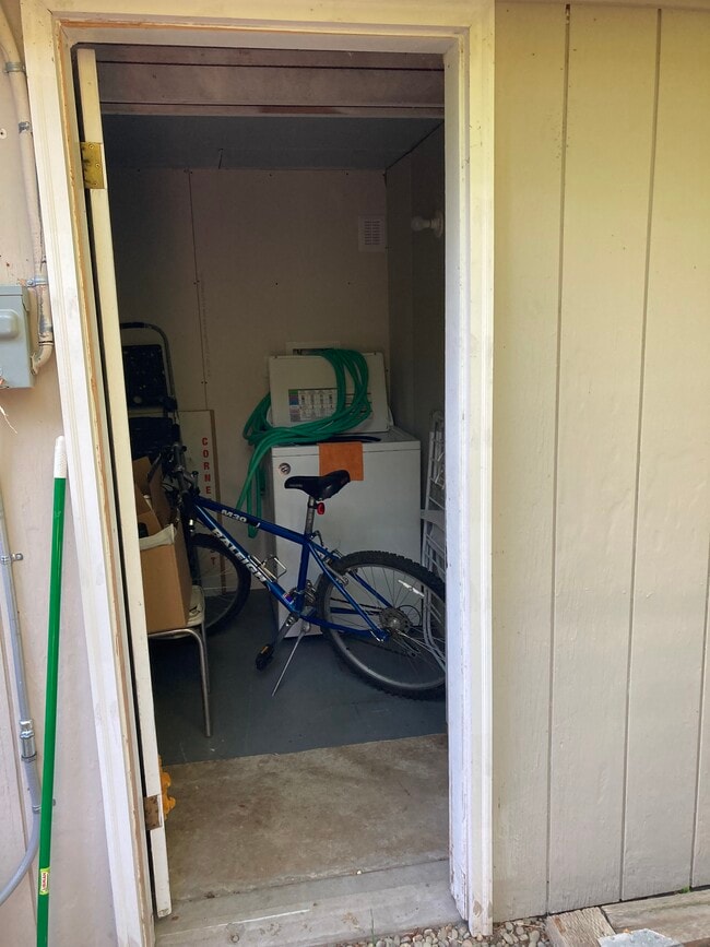 Storage w space for a bike, laundry hookup