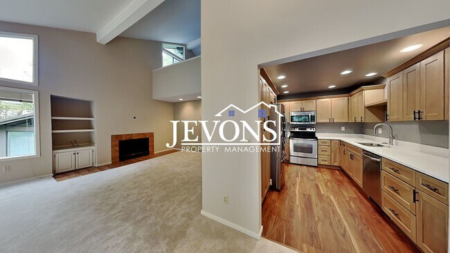 Photo - Top-floor 2-level condo with brand-new kit...