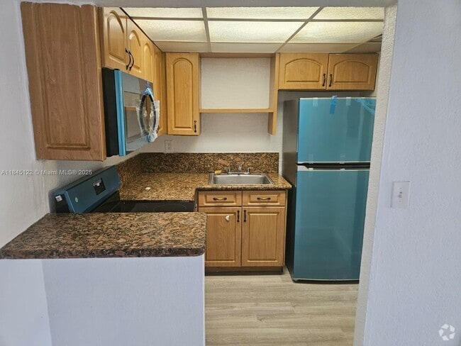 Building Photo - 8001 W 6th Ave Unit C Rental