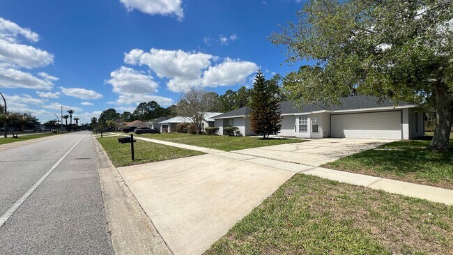 Photo - Bright & Spacious 3/2 Home with Huge Yard + Screened Patio — Lawn Care Included!
