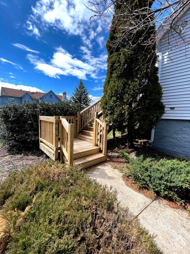 Side entrance to private deck (deck is stained now) - 218 Charter Oak St Unit 218