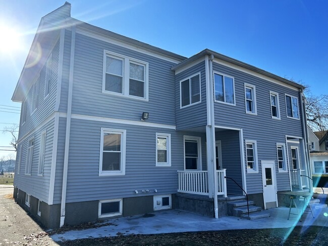 Back view of building, on site parking off street.