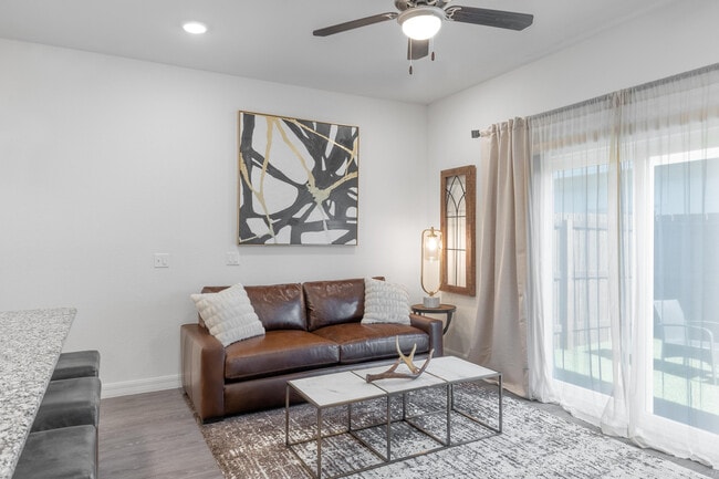 Experience a chic and inviting atmosphere in this beautifully designed living space.