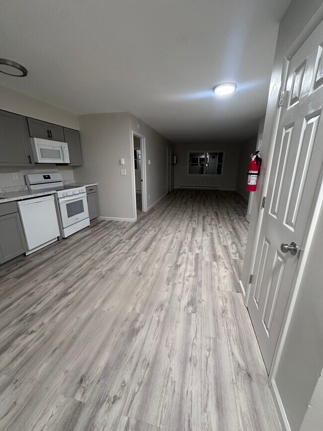 Eat in kitchen with open floor plan to living room - Saugerties Cove View Apartment Homes