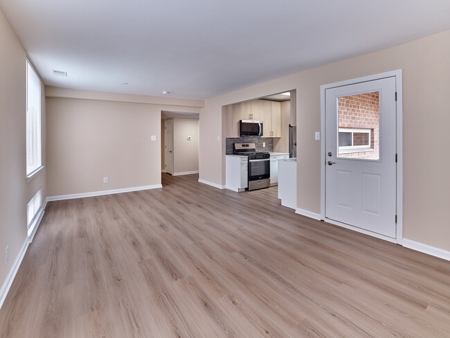 Bright 2 Bed,1.5 Bath with 989 sq. ft., open living space, and modern kitchen finishes.