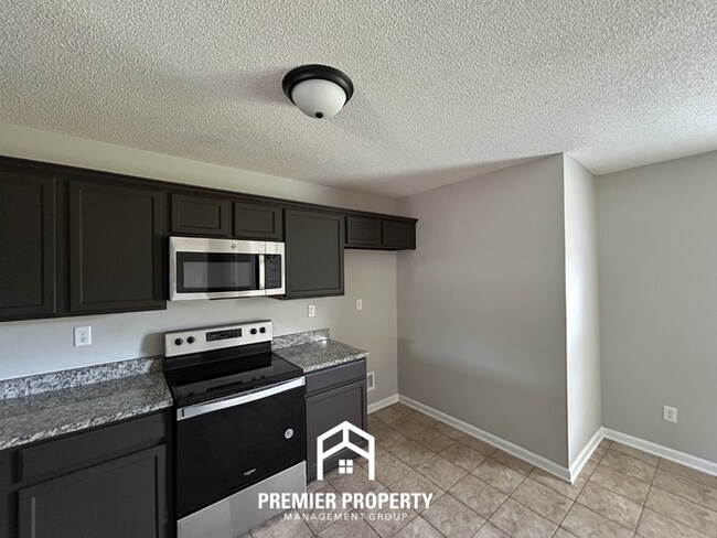 Photo - Modern 3BR/2BA in 38125 | Vaulted Ceilings, Stone Fireplace & 2-Car Garage