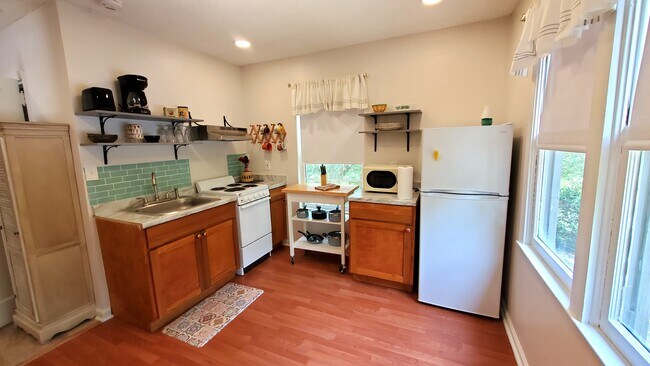 kitchen with a small table 2 chairs - 191 Thurston Dr NW Unit Retro Studio